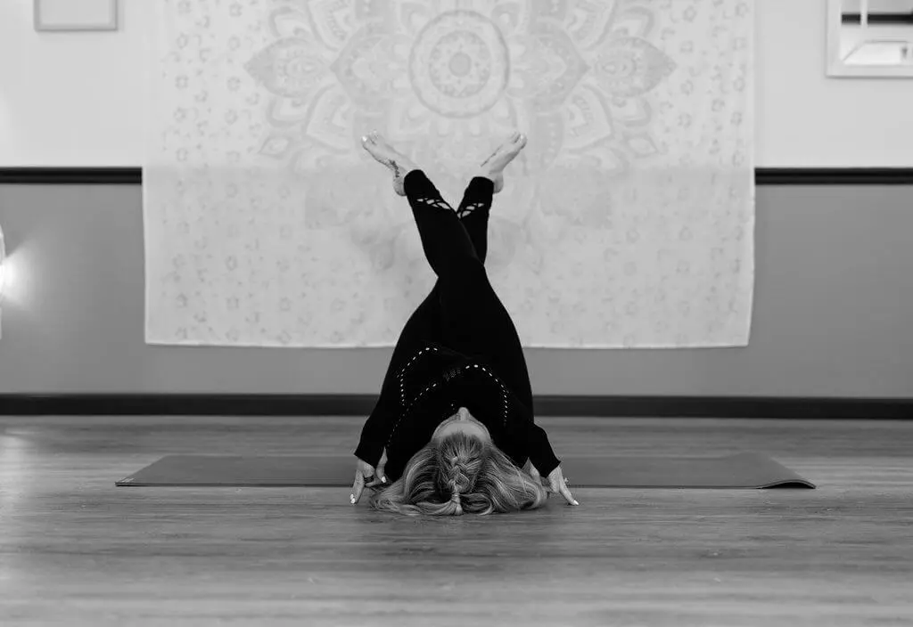 A person doing a handstand on the floor